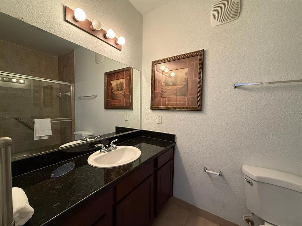 1361 Tuscan Terrace, Unit 7307 Davenport, FL 33896 - Photo 15 of 22 a bathroom with a sink vanity granite and toilet