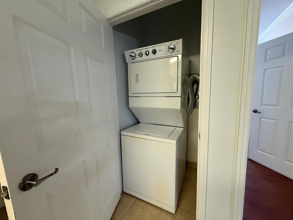 1361 Tuscan Terrace, Unit 7307 Davenport, FL 33896 - Photo 20 of 22 a utility room with dryer and washer