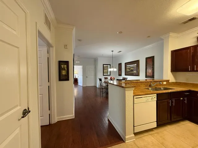 a kitchen with stainless steel appliances granite countertop a stove and a sink