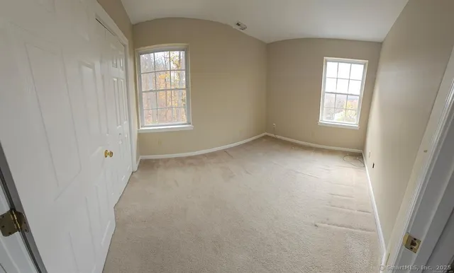 an empty room with windows