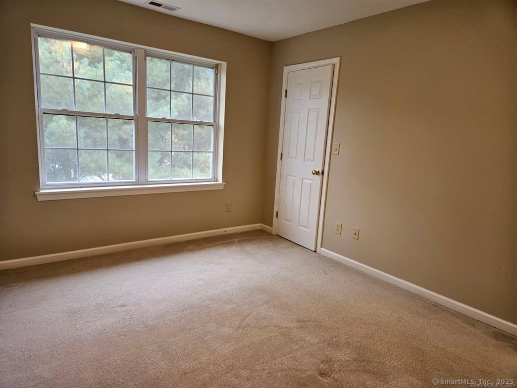165 Osborn Road Naugatuck, CT 06770 - Photo 17 of 23 an empty room with windows and closet