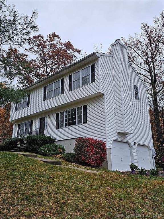 165 Osborn Road Naugatuck, CT 06770 - Photo 2 of 23 a front view of a house with garden