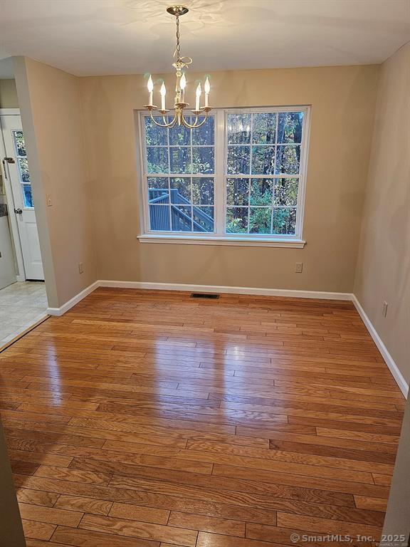 165 Osborn Road Naugatuck, CT 06770 - Photo 6 of 23 wooden floor in an empty room with a window