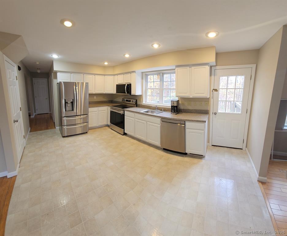 165 Osborn Road Naugatuck, CT 06770 - Photo 9 of 23 a kitchen with refrigerator and cabinets