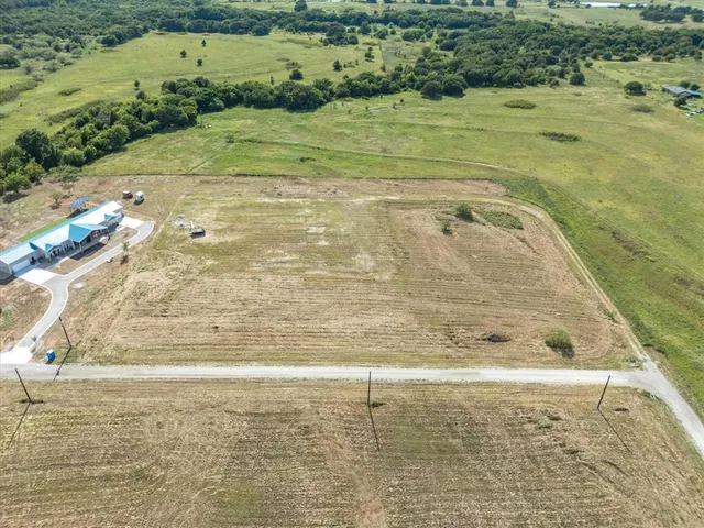 an arial view of a house with a yard