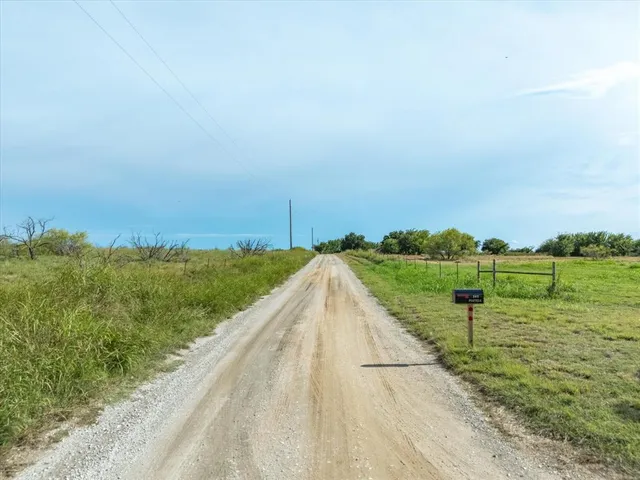 a view of a golf course with a lake view