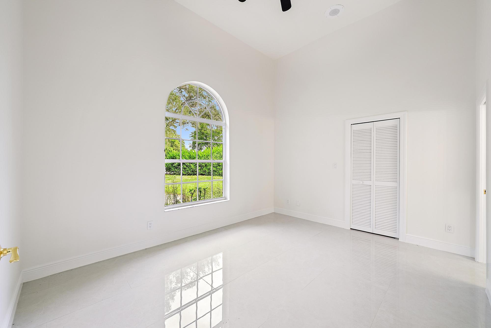 19558 Red Gum Trail Jupiter, FL 33458 - Photo 14 of 34 an empty room with windows