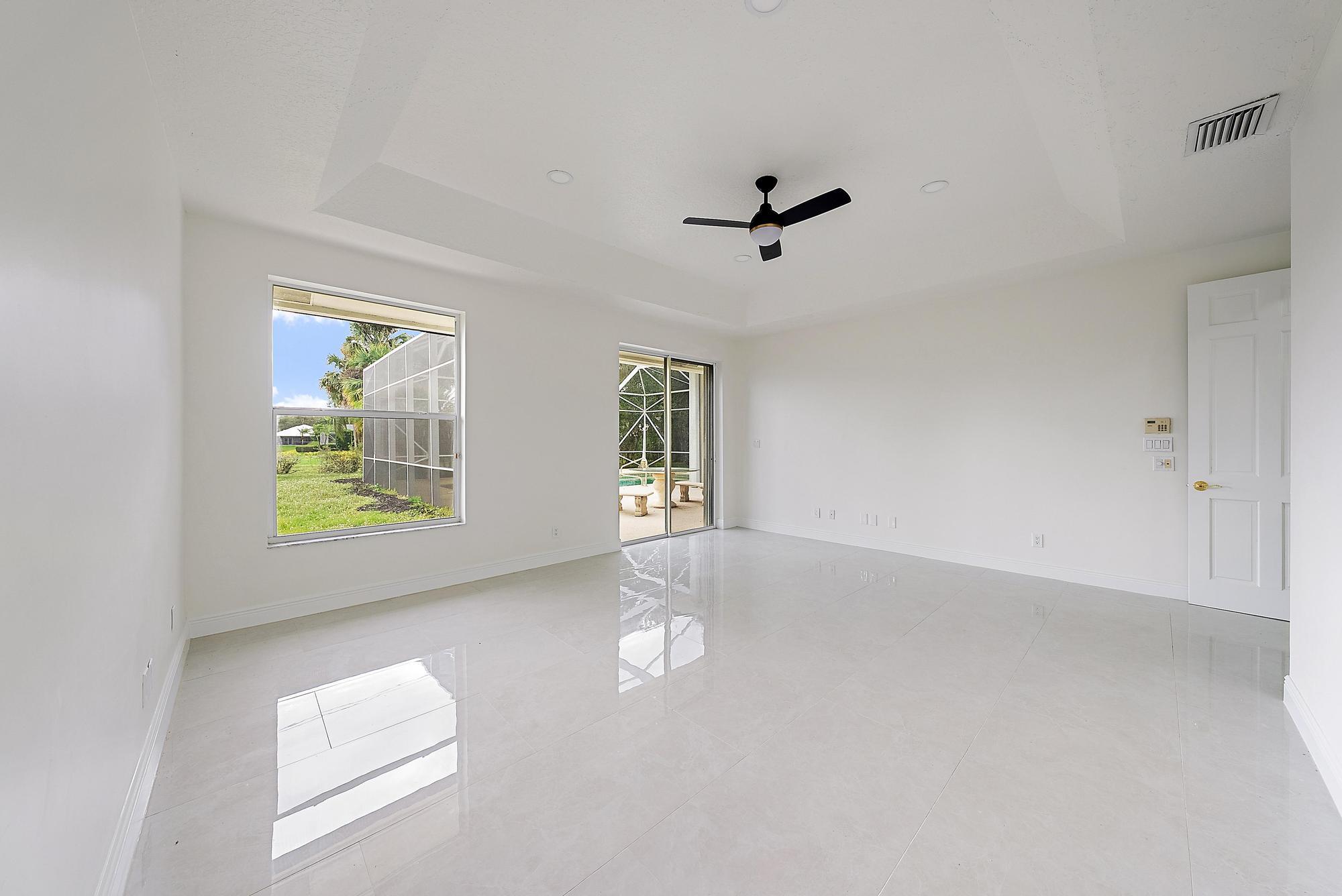 19558 Red Gum Trail Jupiter, FL 33458 - Photo 17 of 34 an empty room with windows