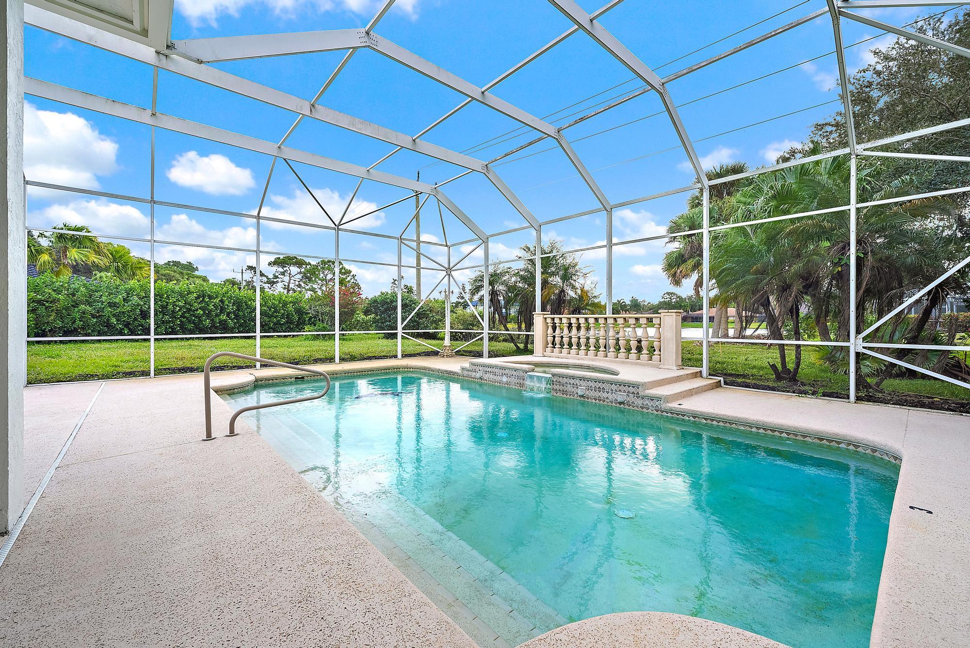 19558 Red Gum Trail Jupiter, FL 33458 - Photo 25 of 34 a view of a house with a swimming pool