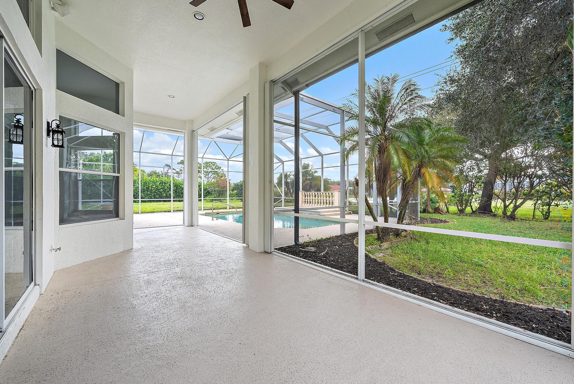 19558 Red Gum Trail Jupiter, FL 33458 - Photo 27 of 34 a view of backyard with green space