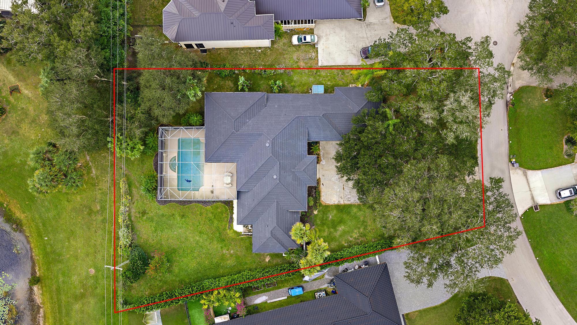 19558 Red Gum Trail Jupiter, FL 33458 - Photo 32 of 34 an aerial view of a house with a garden