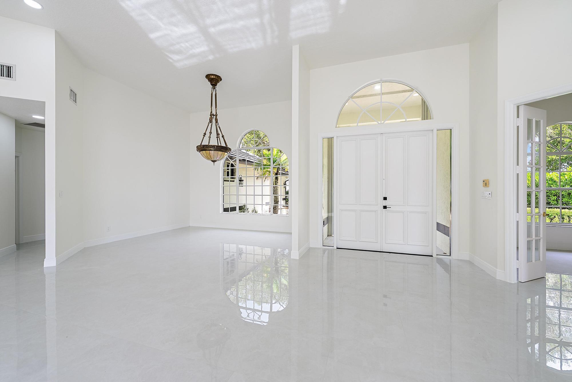 19558 Red Gum Trail Jupiter, FL 33458 - Photo 6 of 34 a view of a room with wooden floor and window