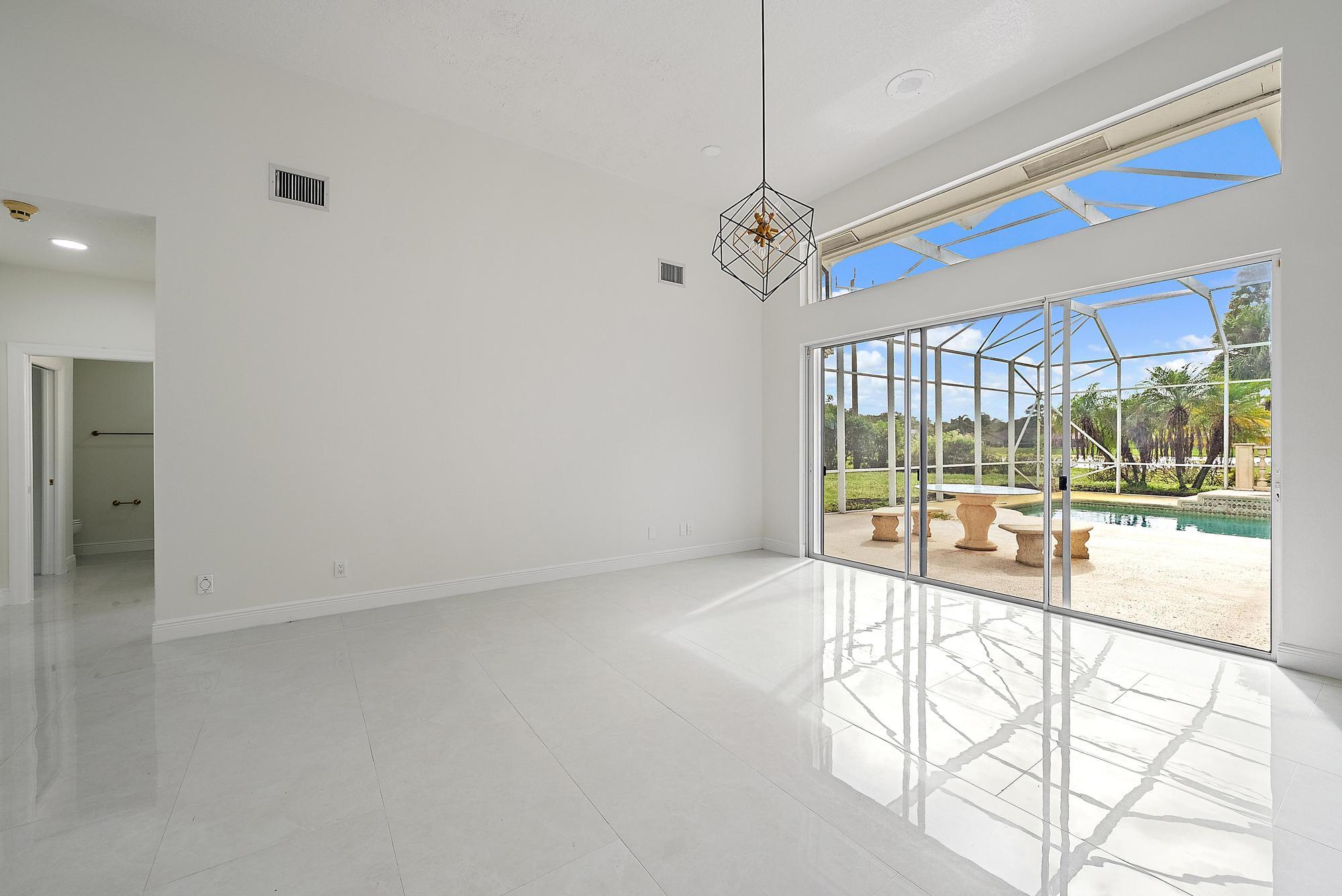 19558 Red Gum Trail Jupiter, FL 33458 - Photo 10 of 34 a view of an empty room with a window