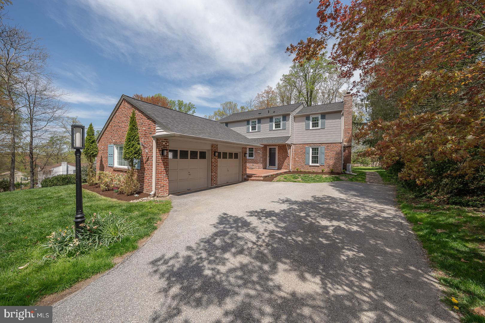 621 Vassar Road Wayne, PA 19087 - Photo 1 of 37 a front view of a house with a yard and garage