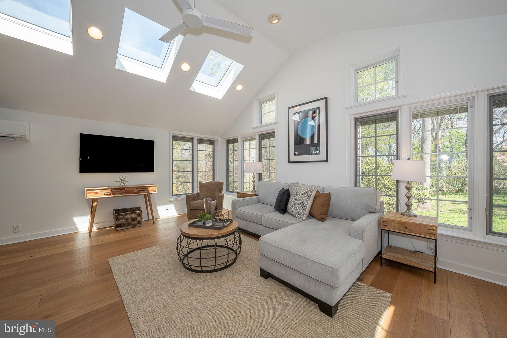 621 Vassar Road Wayne, PA 19087 - Photo 11 of 37 a living room with furniture flat screen tv and a large window