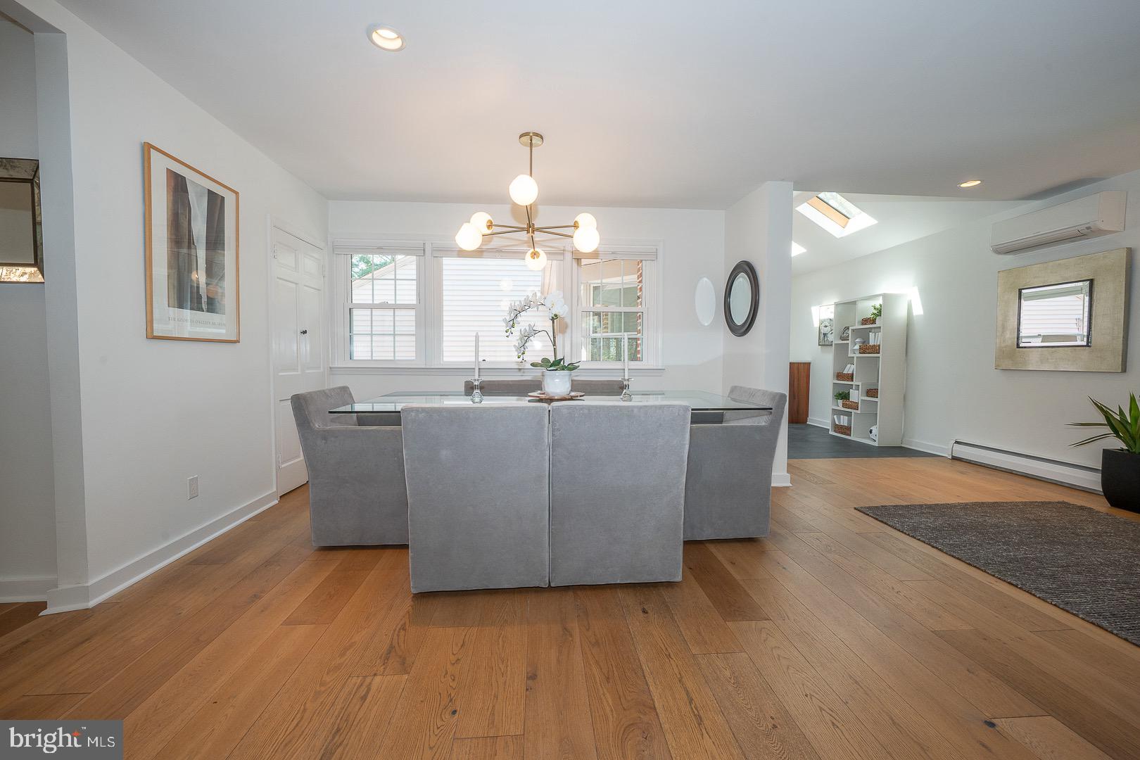 621 Vassar Road Wayne, PA 19087 - Photo 14 of 37 a view of a dining room with furniture a chandelier and wooden floor