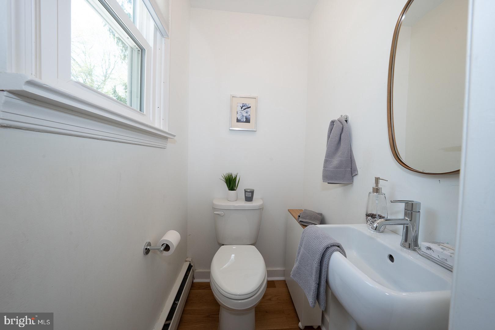 621 Vassar Road Wayne, PA 19087 - Photo 21 of 37 a bathroom with a toilet sink and mirror