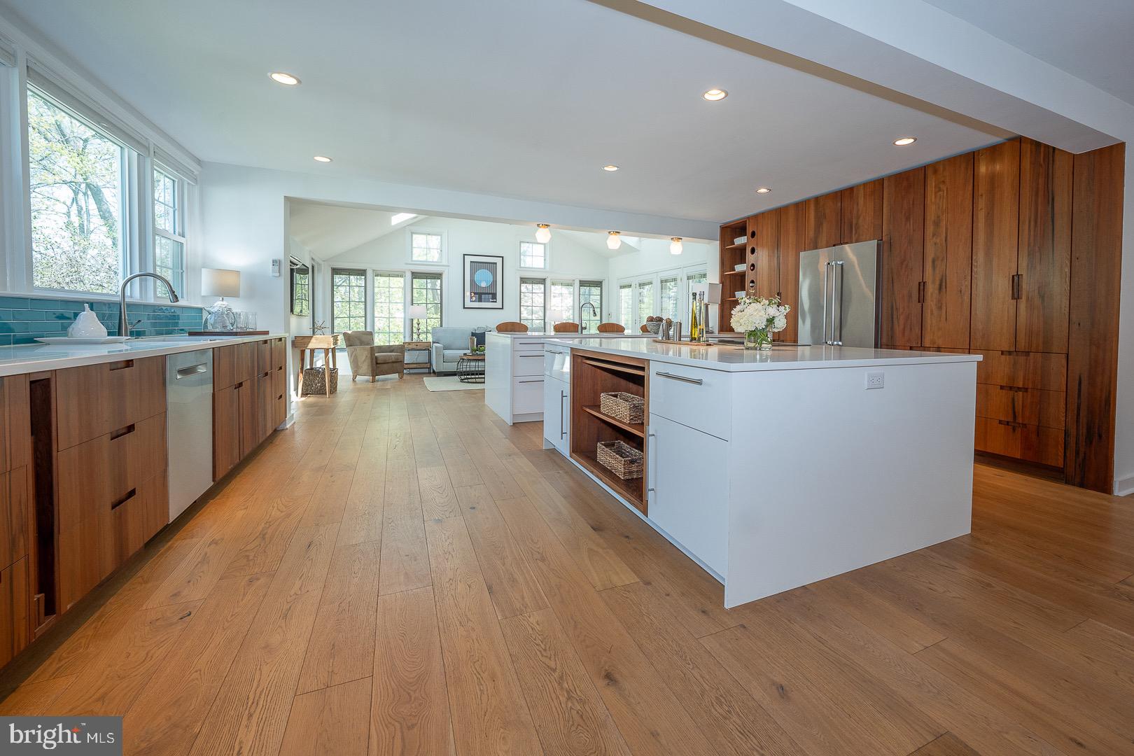 621 Vassar Road Wayne, PA 19087 - Photo 37 of 37 a kitchen with stainless steel appliances kitchen island wooden floors and center island