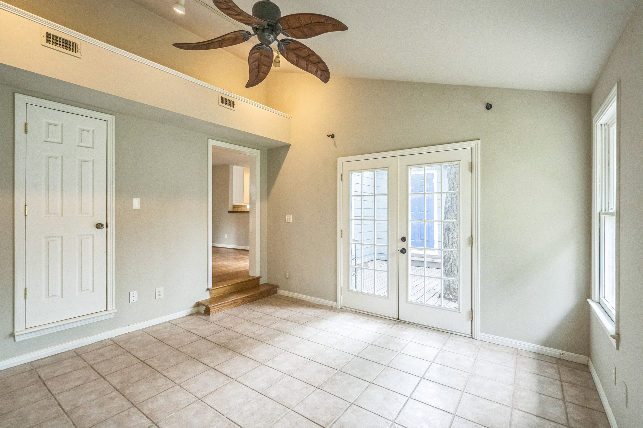 1402 Laurel Street, Unit B Georgetown, TX 78626 - Photo 6 of 21 Spare room featuring lofted ceiling, french doors, light tile patterned floors, and ceiling fan