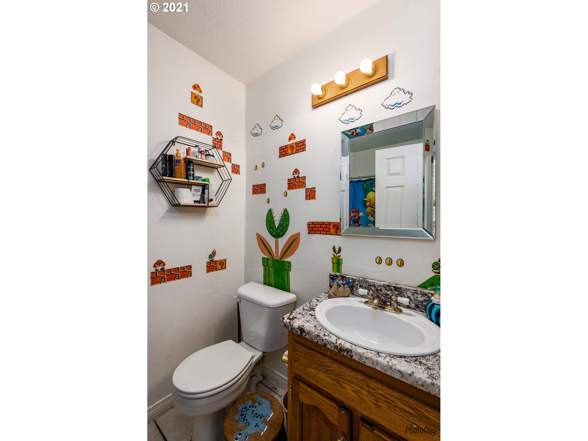 7277 Forsythia Street Springfield, OR 97478 - Photo 18 of 29 a bathroom with a sink toilet mirror and vanity