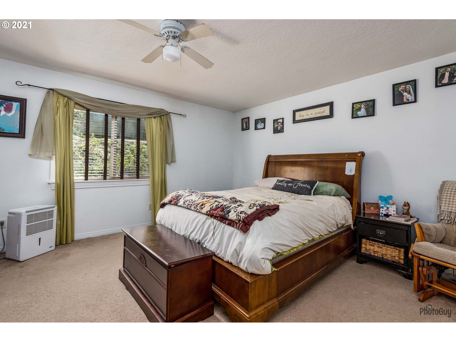 7277 Forsythia Street Springfield, OR 97478 - Photo 19 of 29 a bedroom with a bed dresser and window