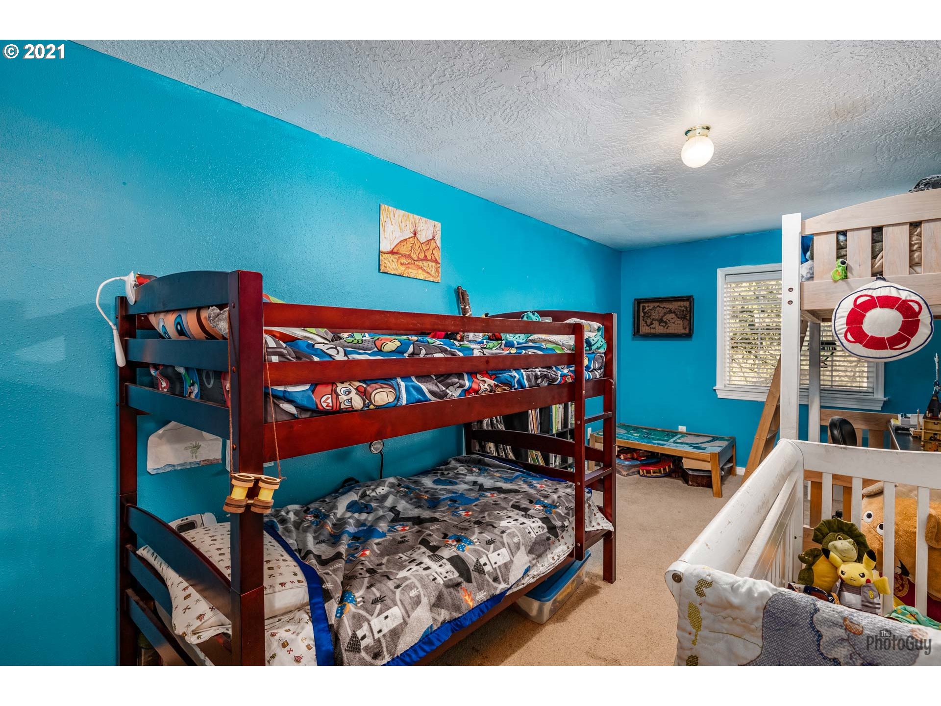 7277 Forsythia Street Springfield, OR 97478 - Photo 23 of 29 a bedroom with a bed and a dresser in it
