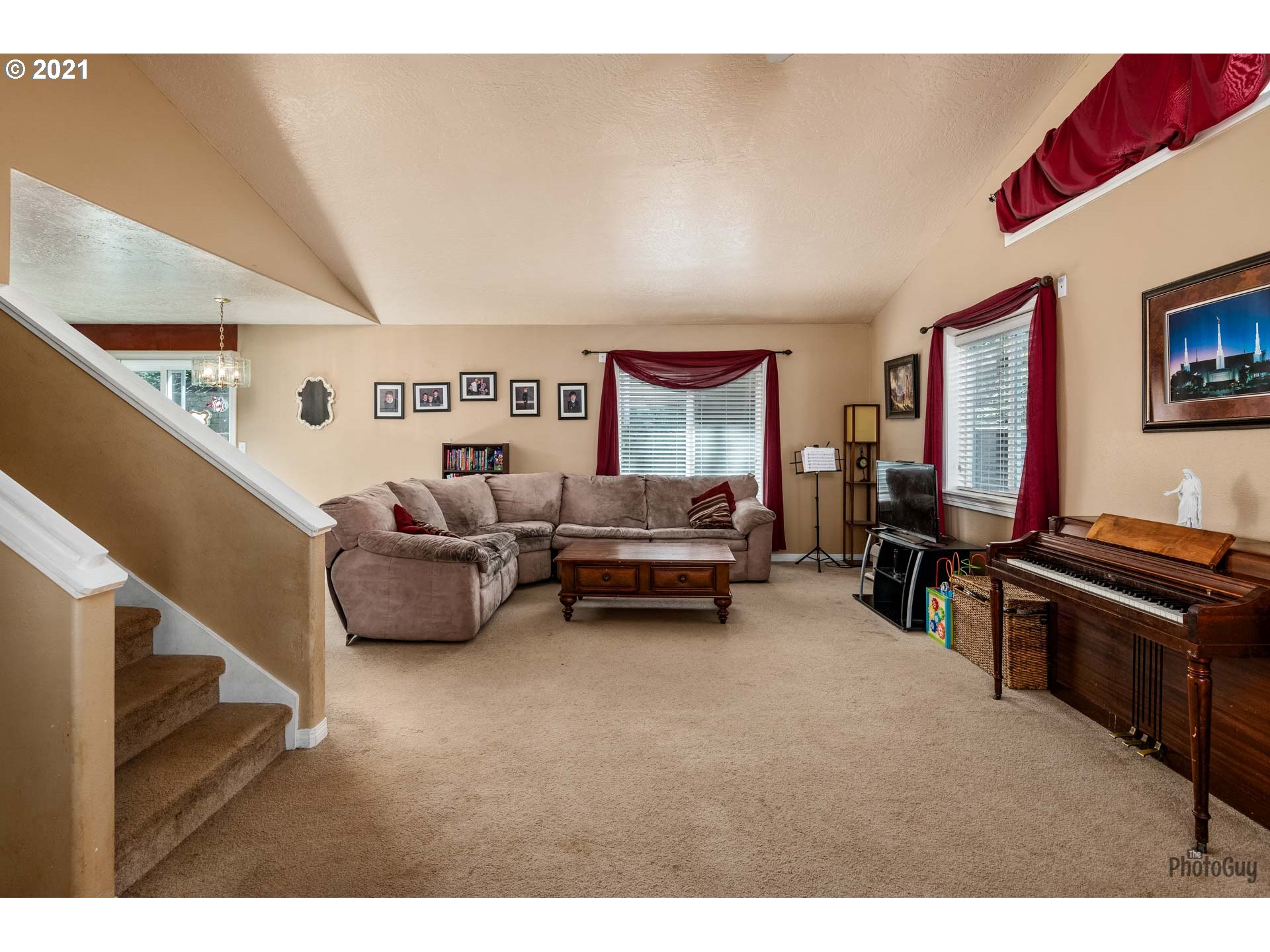 7277 Forsythia Street Springfield, OR 97478 - Photo 8 of 29 a living room with furniture and a flat screen tv