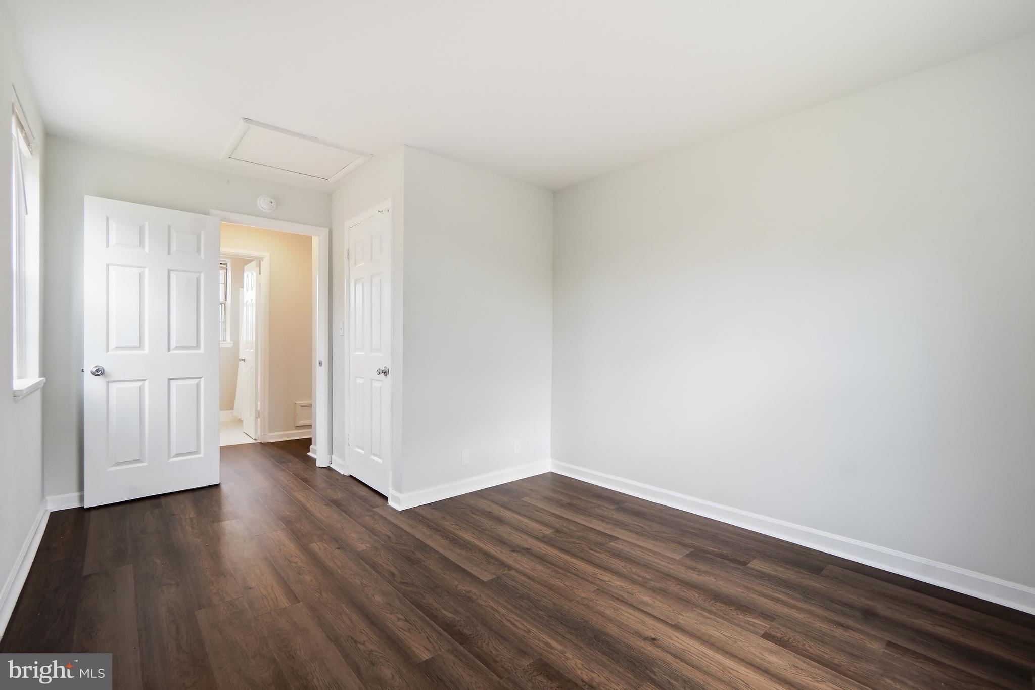 4905 29th Road South, Unit B1 Arlington, VA 22206 - Photo 18 of 52 a view of a room with wooden floor and white walls