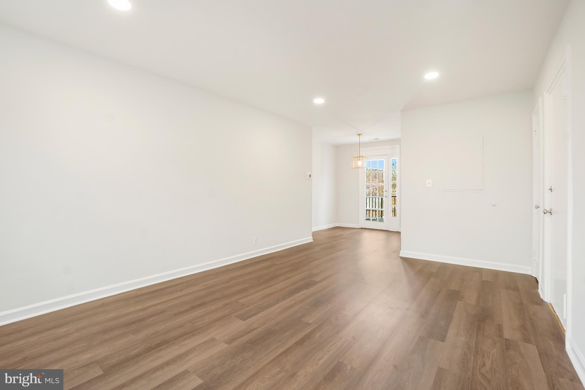 4905 29th Road South, Unit B1 Arlington, VA 22206 - Photo 3 of 52 a view of empty room with wooden floor and fan