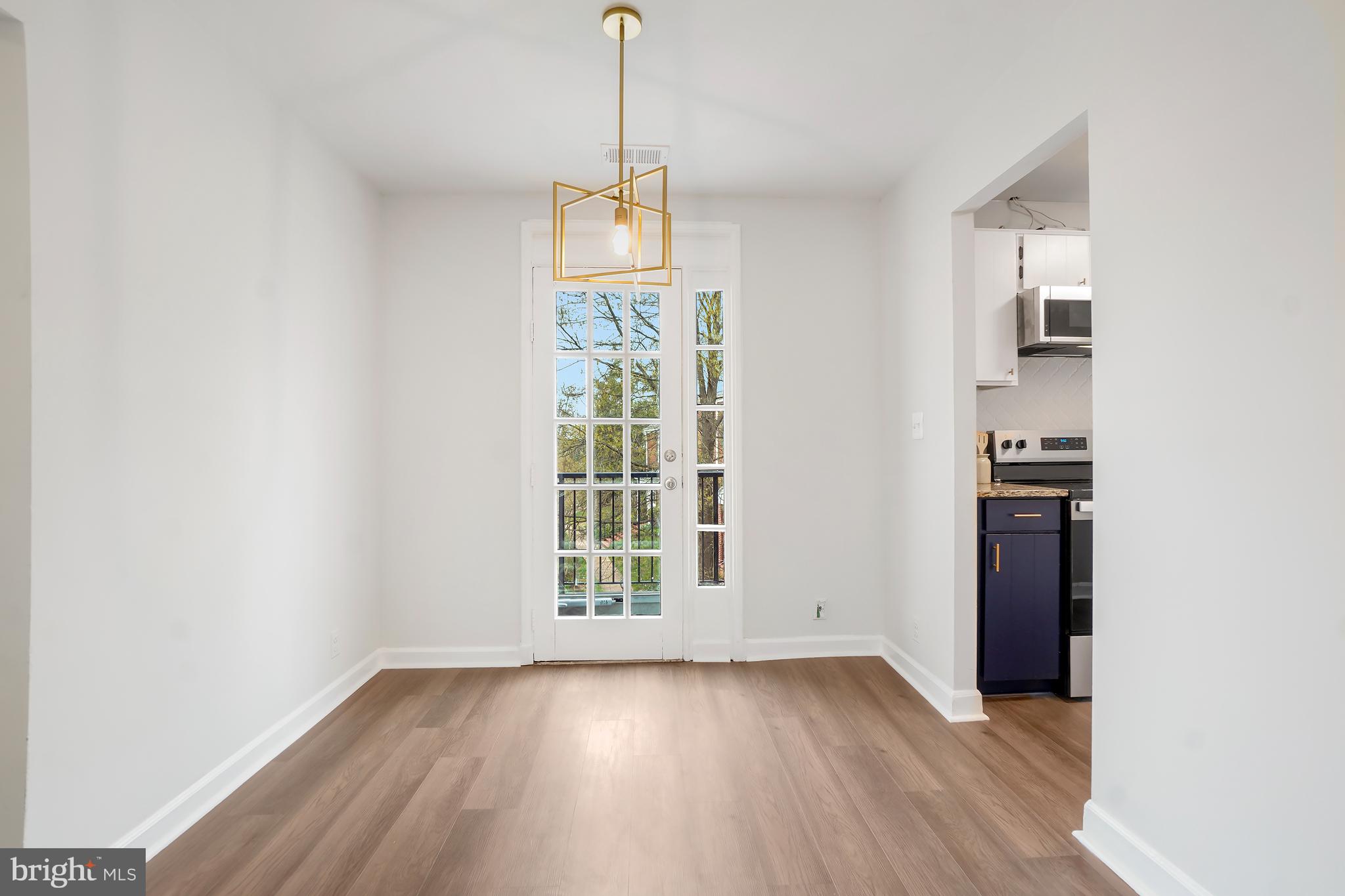 4905 29th Road South, Unit B1 Arlington, VA 22206 - Photo 6 of 52 wooden floor in an empty room with a window