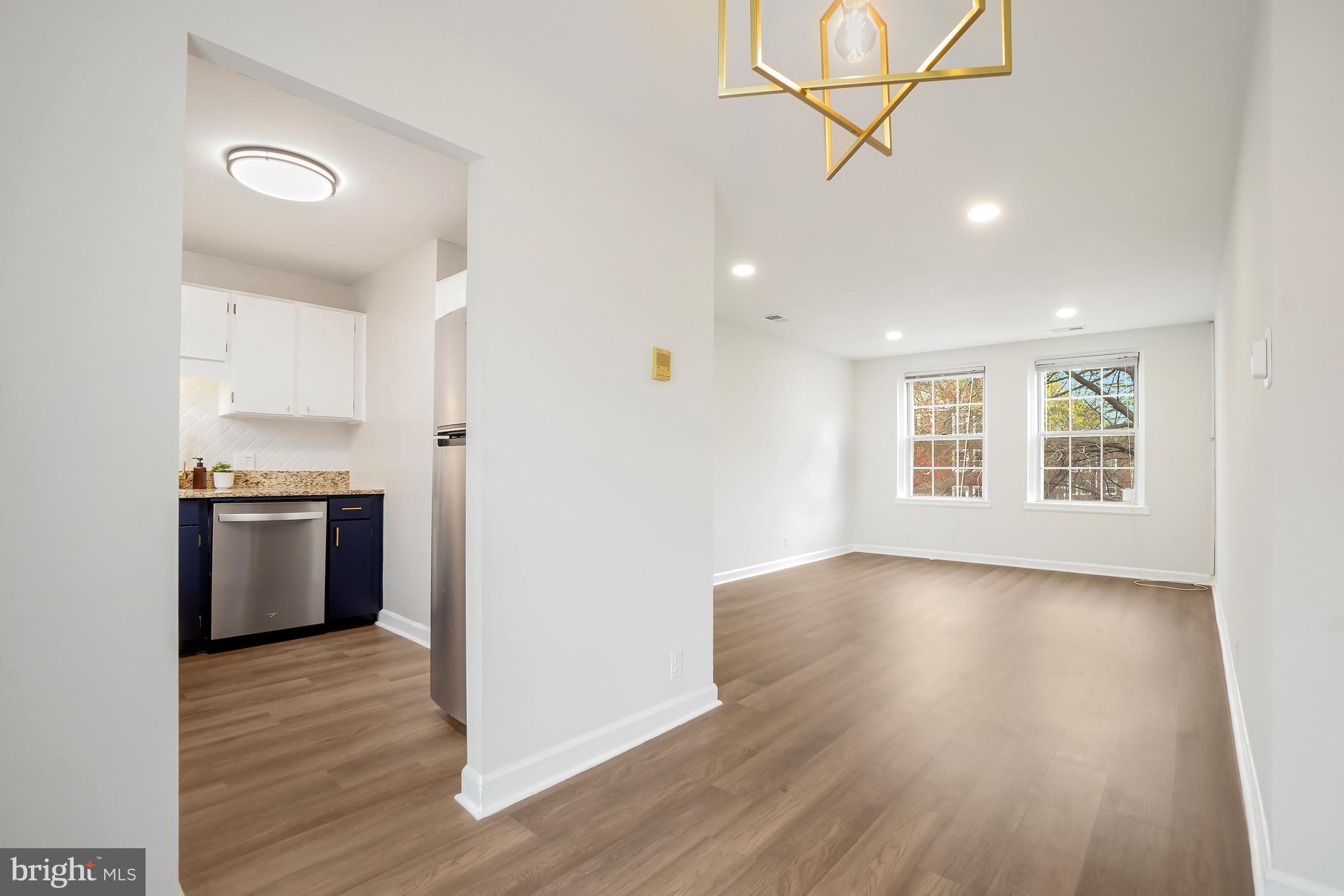 4905 29th Road South, Unit B1 Arlington, VA 22206 - Photo 9 of 52 a view of a kitchen with wooden floor and a window