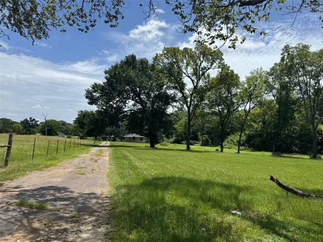 a view of a golf course with a lake
