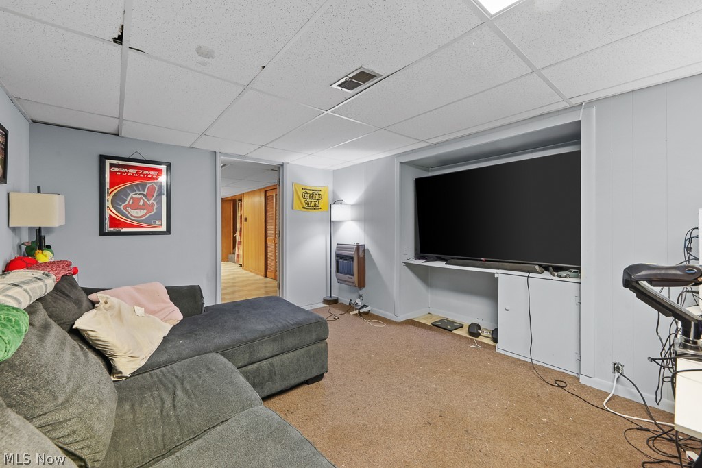 611 Herbert Road Akron, OH 44312 - Photo 27 of 30 Recreational room featuring a large built-in media niche, drop ceiling, and light-toned carpet flooring