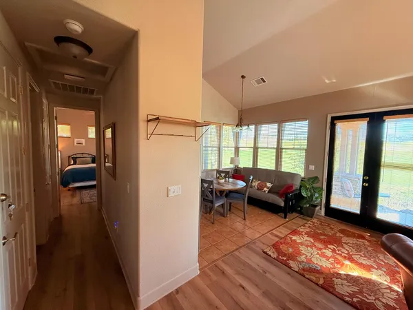 a bedroom with a bed and a view of bathroom