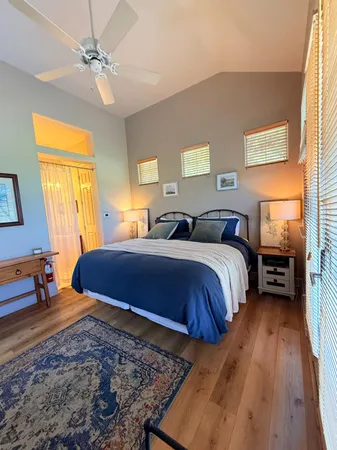 a bedroom with double bed and a window