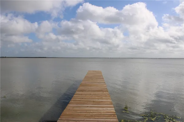 a view of wooden floor with a lake view