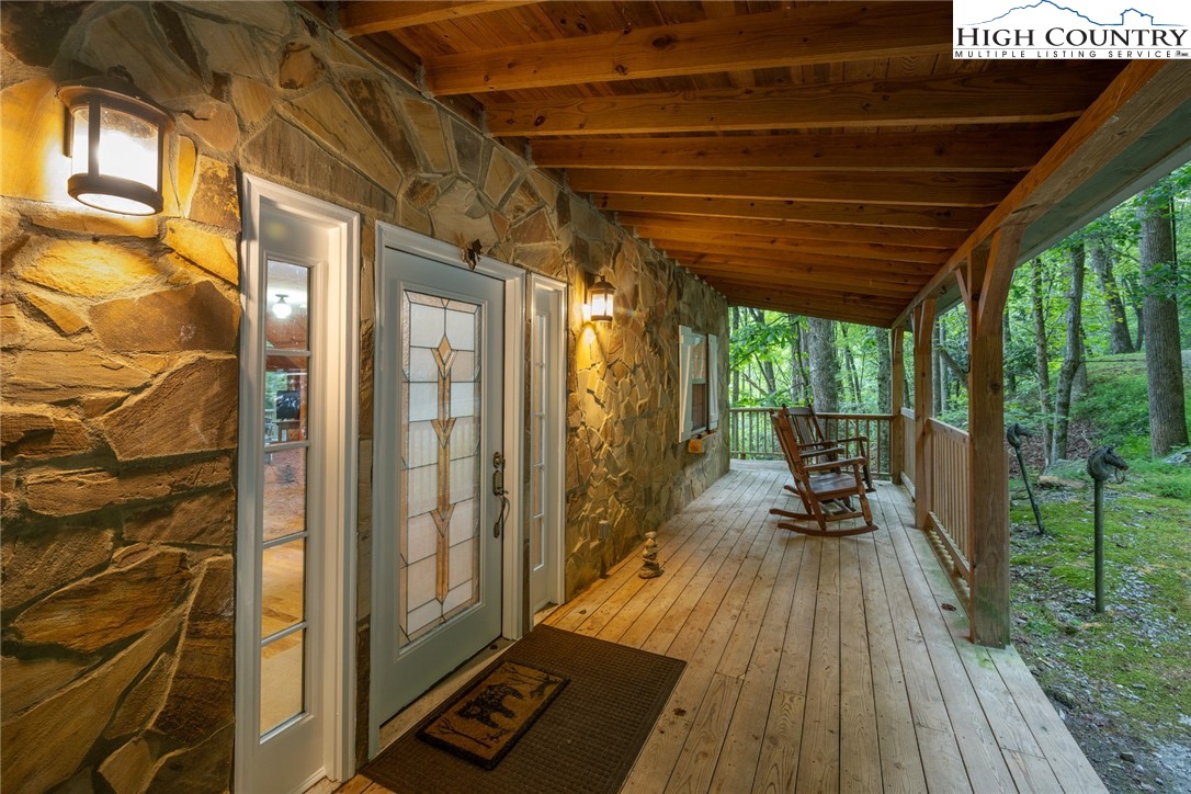 683 Hawkbill Road Ferguson, NC 28624 - Photo 8 of 26 a view of a balcony with wooden floor