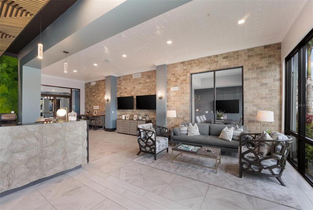 2201 Northwest Federal Highway, Unit 3B1209 Stuart, FL 34994 - Photo 18 of 47 a living room with furniture and a flat screen tv