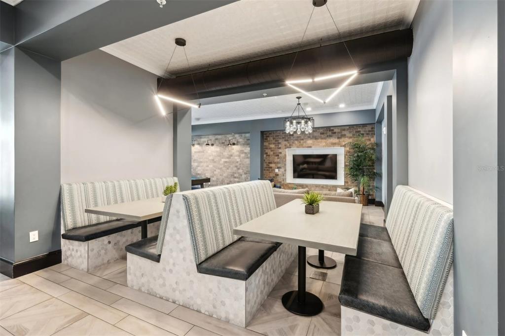 2201 Northwest Federal Highway, Unit 3B1209 Stuart, FL 34994 - Photo 23 of 47 a living room with furniture and a fireplace