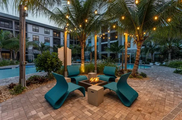a view of an outdoor dining space with a patio