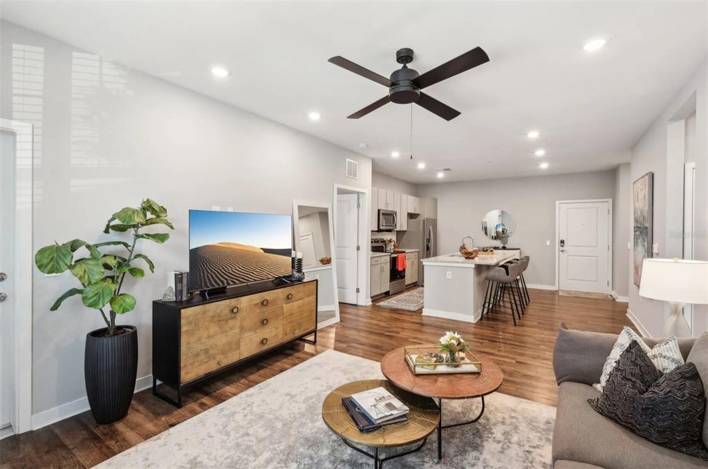 2201 Northwest Federal Highway, Unit 3B1209 Stuart, FL 34994 - Photo 6 of 47 a living room with furniture and a wooden floor