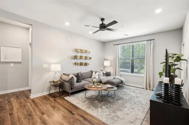 a living room with furniture and a window