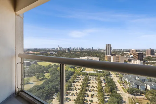 a view of a city skyline from a balcony