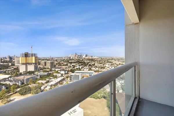 a view of a balcony with city view