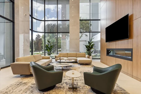 a living room with fireplace furniture and a flat screen tv