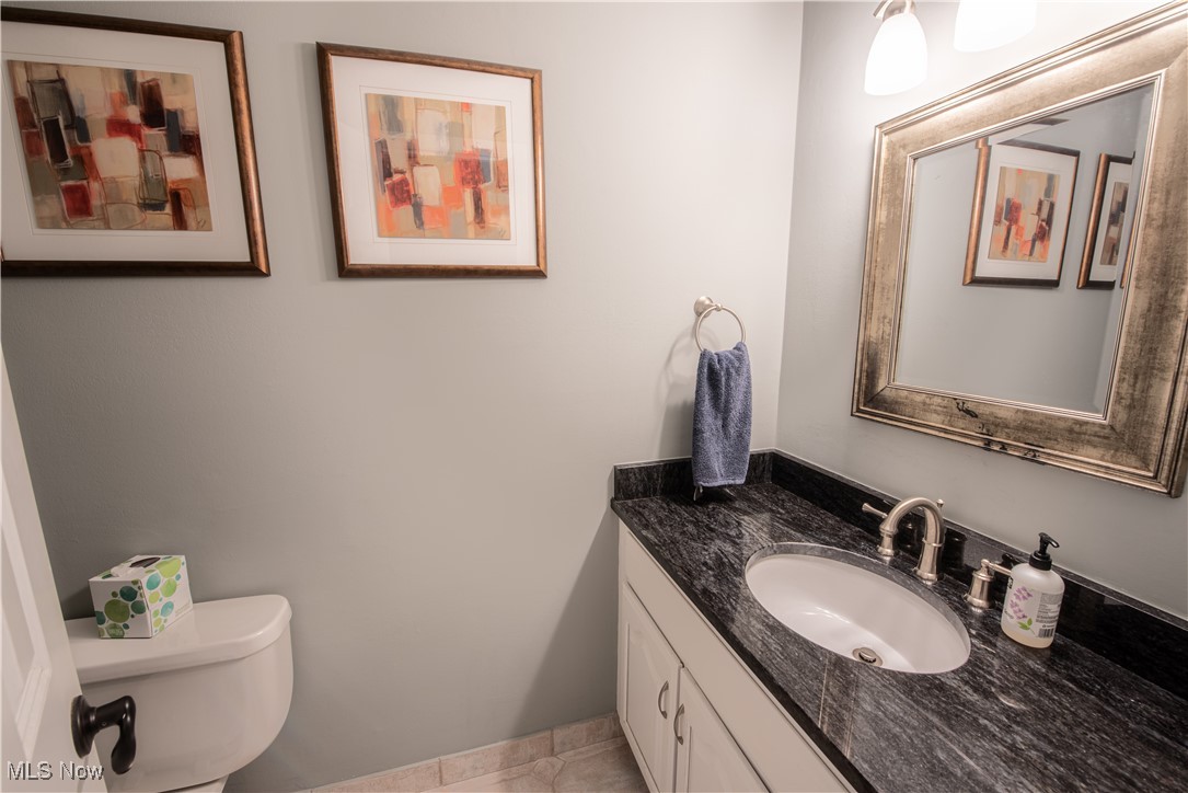 28314 Knickerbocker Road Bay Village, OH 44140 - Photo 20 of 38 Bathroom with tile patterned flooring, vanity, and toilet