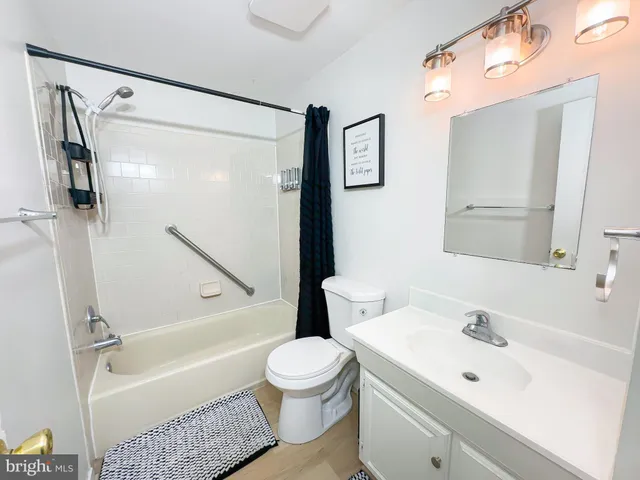 a bathroom with a sink a toilet and a bathtub