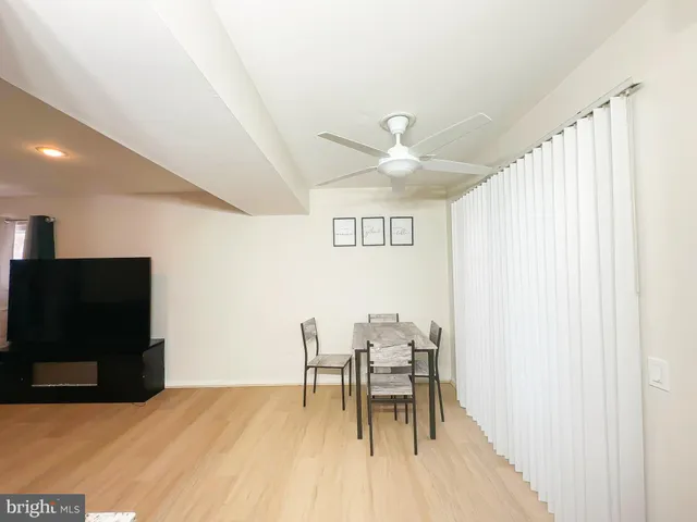 a view of dining room with furniture and wooden floor