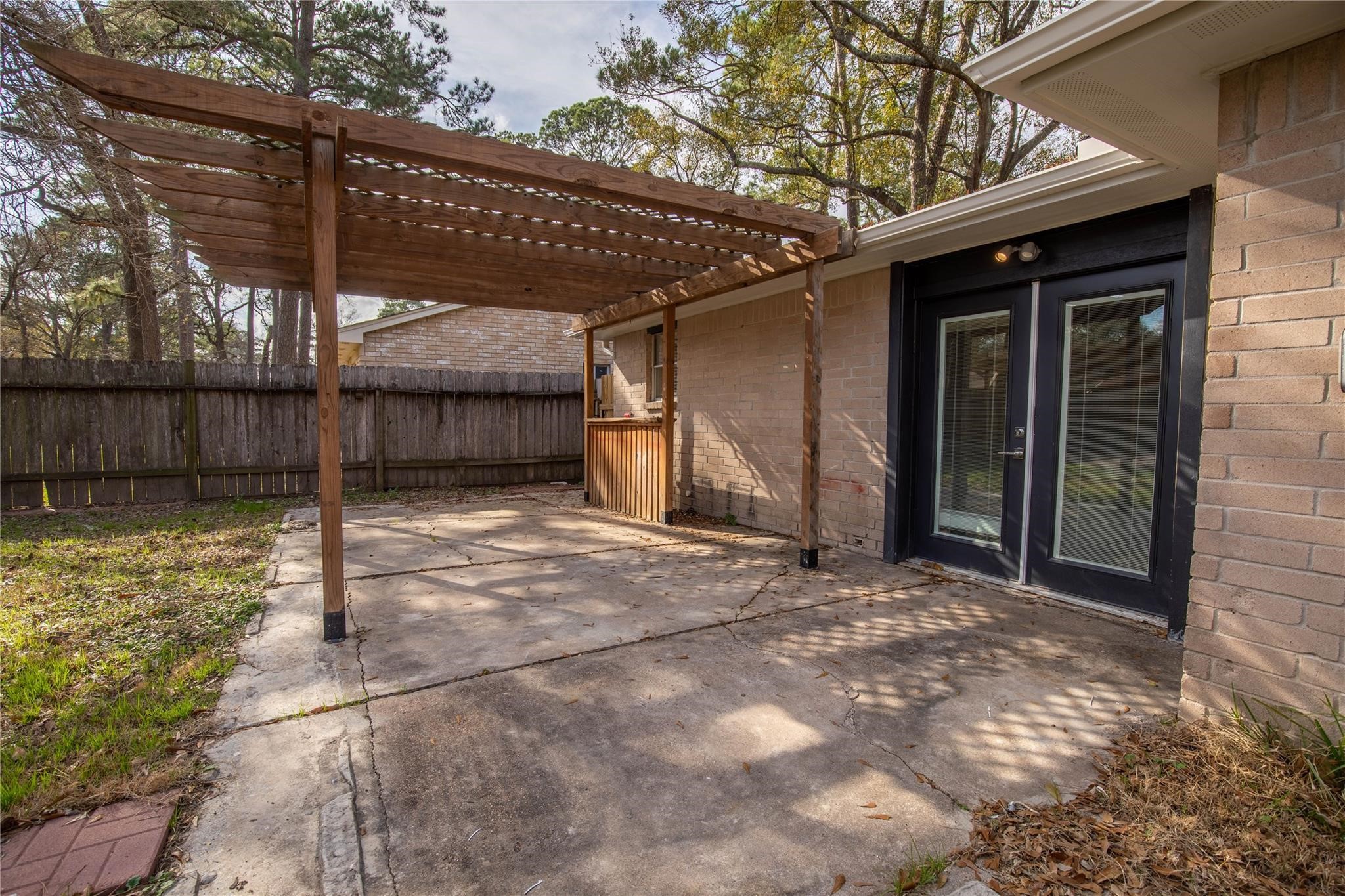 4419 Reynaldo Drive Spring, TX 77373 - Photo 9 of 13 Back yard patio area with doors to dining and living