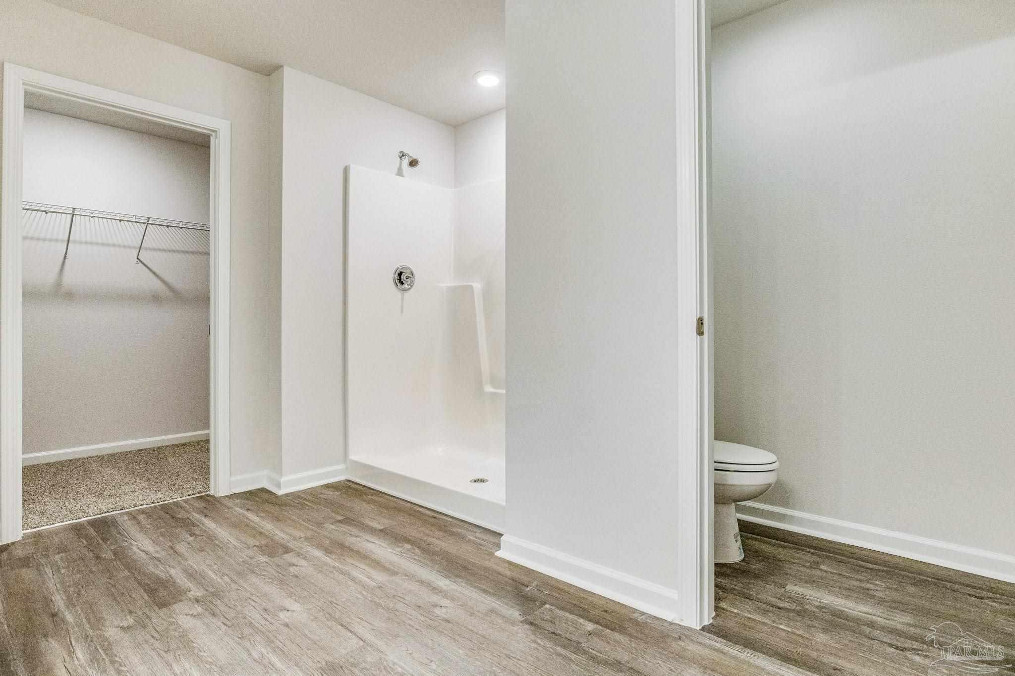 9823 MilleeLoop Loop Pensacola, FL 32526 - Photo 20 of 50 a bathroom view of a toilet and a shower